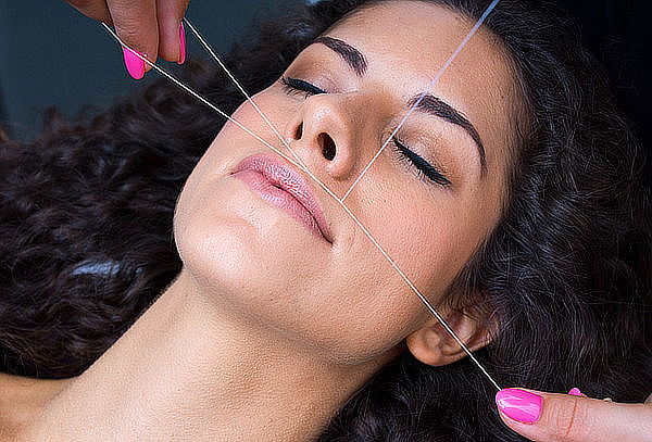 Depilación facial con hilo, rostro completo en Providencia